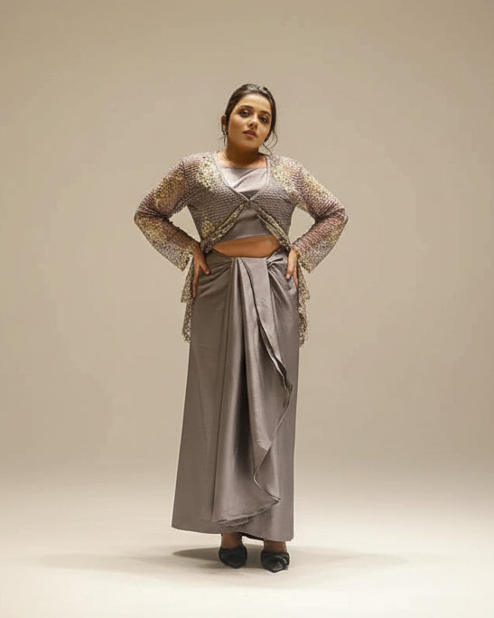 Woman posing in front of a textured wall